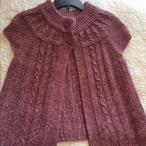 Pinkish purple sweater vest.